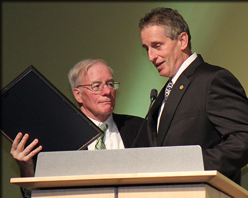 Neil Murphy receiving a proclamation from the governor from Lt. Gov. Robert J. Duffy
