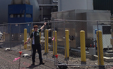 Autumn Elniski strikes a pose in front of the effluent treatment plant at Norampac.