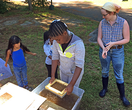 Emma Percy teaches paper making to girls from Girls, Inc., a Syracuse-based agency that inspires all girls to be strong, smart, and bold.