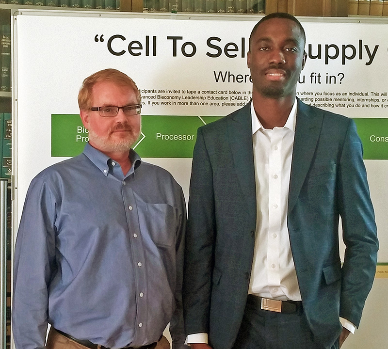 Dr. Timothy Volk and Ph.D. candidate Obste Therasme