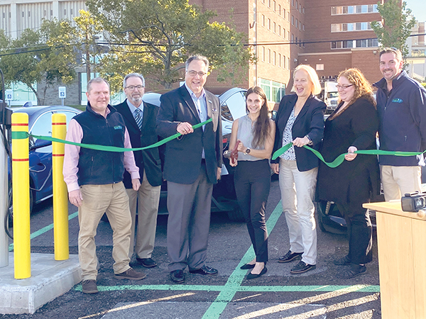 happy people at ESF's EV charging station ribbon cutting ceremony