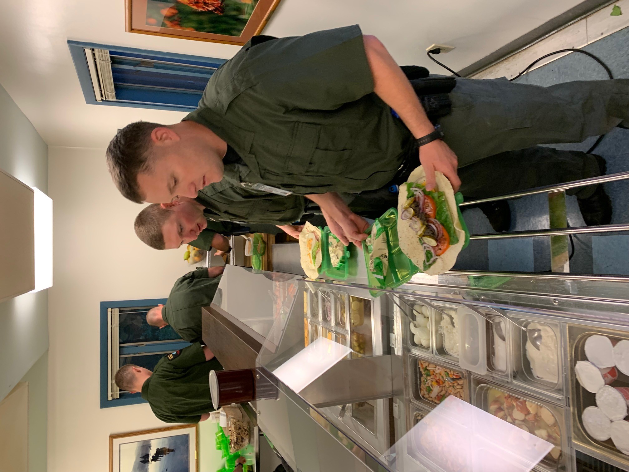 Rangers make lunch, using reusable containers, at the newcomb campus