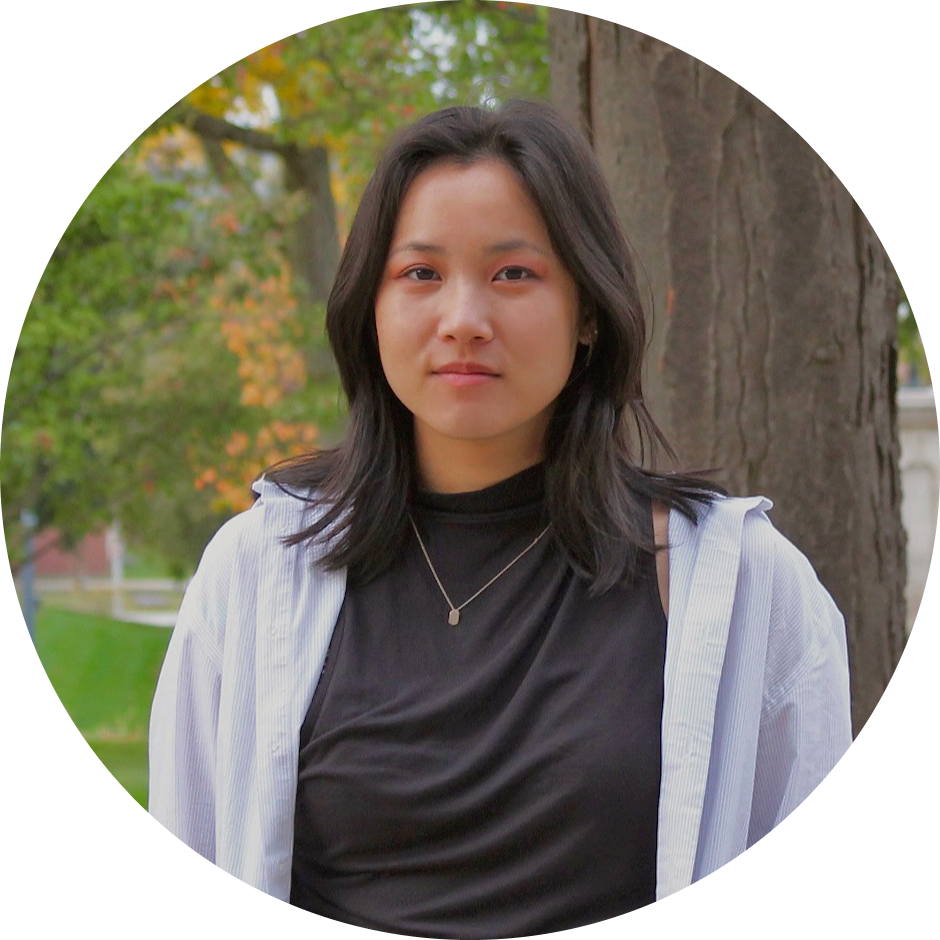 shirley chen, standing in front of a tree