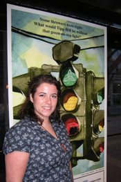 Casey Landerkin standing in front of a poster with traffic lights