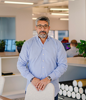 Rich Centolella standing in a office setting