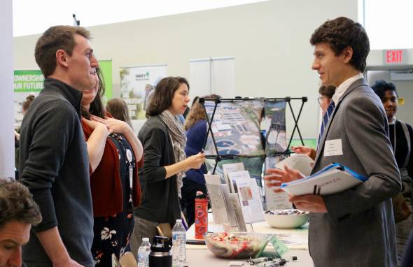 Students and employers interact at a career fair.