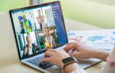 Laptop displaying an online meeting opportunity