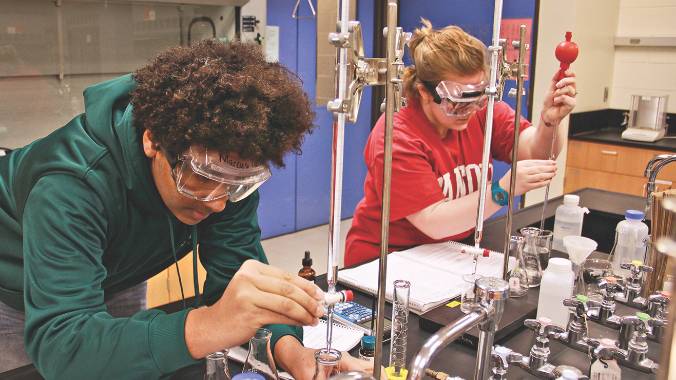 Students working in a chemistry laboratory.