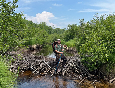 John standing on intact beaver dam on Sucker Brook