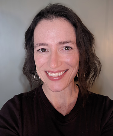 Headshot of Mickki Garrity. She is wearing a black tshirt.