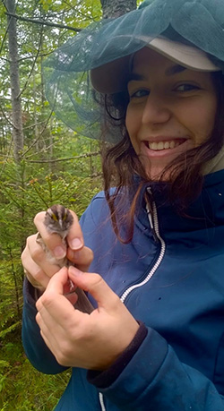 Valerie Chiarini holding a small bird