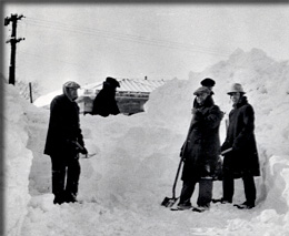 Campus personnel shoveling snow in March 1932.