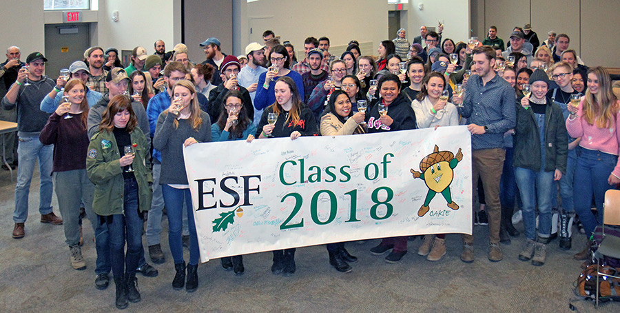 Students at December graduation Champagne Toast