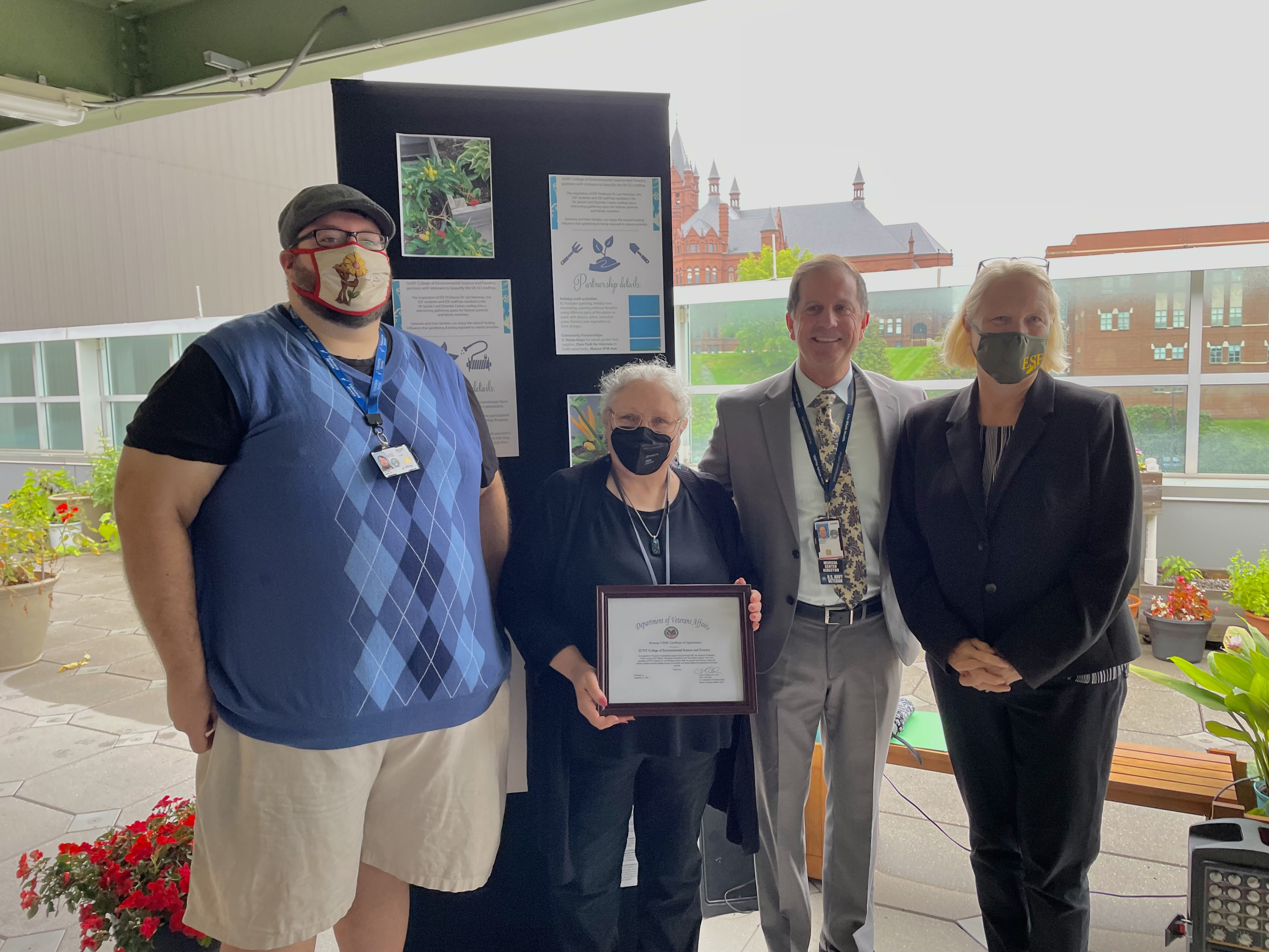 ESF representatives accept a certificate of appreciation from the VA Medical Center