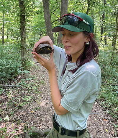 Holly Butcher holding a turtle