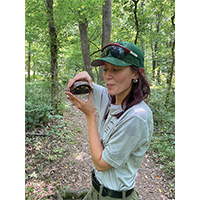 Holly Butcher holding a turtle