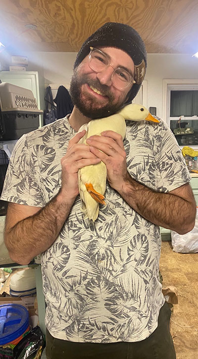 avremi toron holding a duck (soft toy not real duck) 
