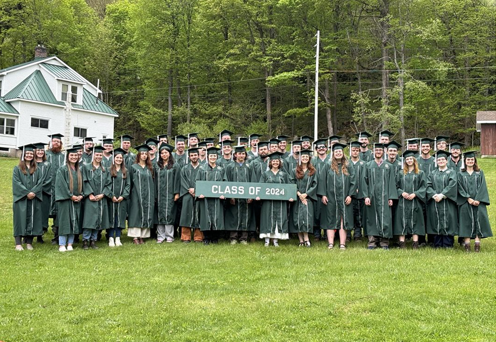 Group of Ranger School graduates holding class of 2024 sign