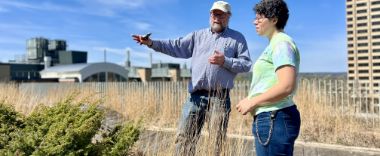 Two people standing on the Gateway Green Roof.