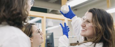 Two people working in a lab environment.