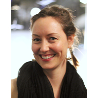 headshot of mikhail haramati. She is wearing a black scarf and smiling with dimples on her left cheek