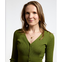 headshot of Remy Moorhead. She is wearing a green top. 