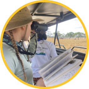 Field workers in an observation vehicle.