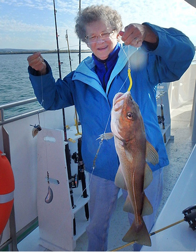 Dr. Karin Limburg with a cod caught in Iceland.