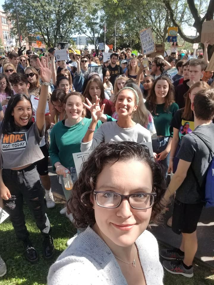 Jess Hess taking a selfie with a group of people