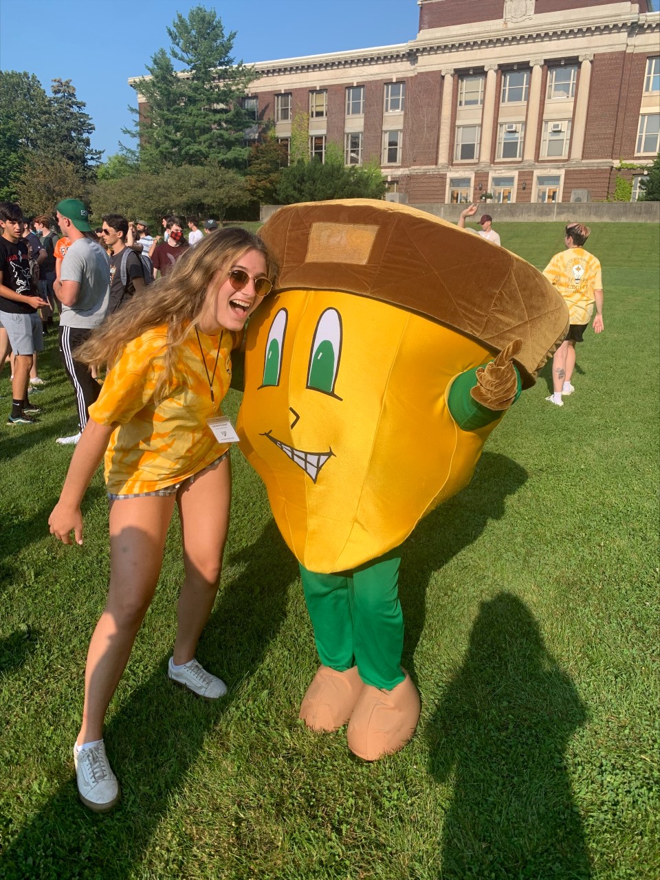 Julia Niehoff on E S F quad with E S F mascot Oakie the acorn