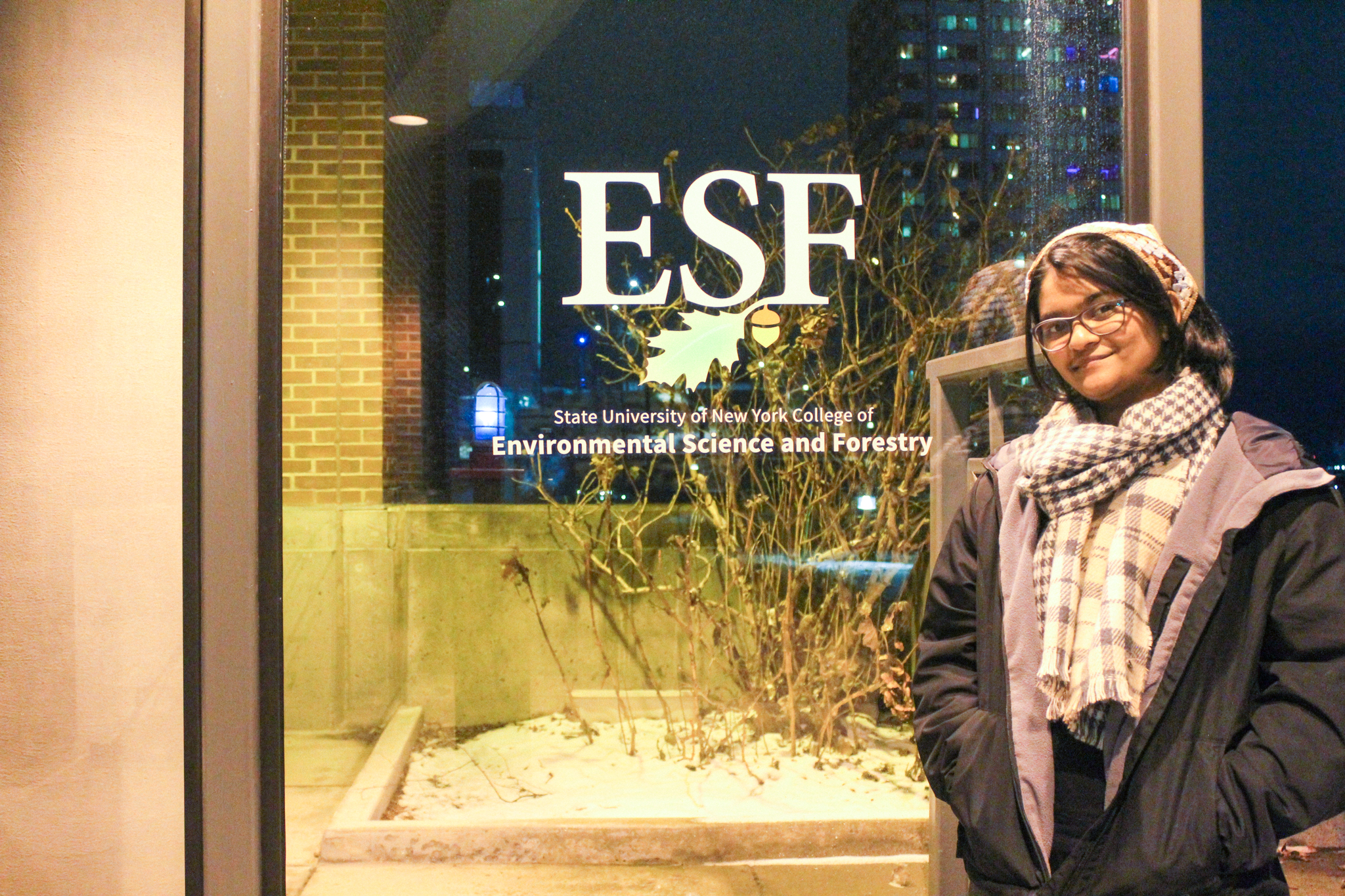 Student Abhinaya Polaka standing by a window