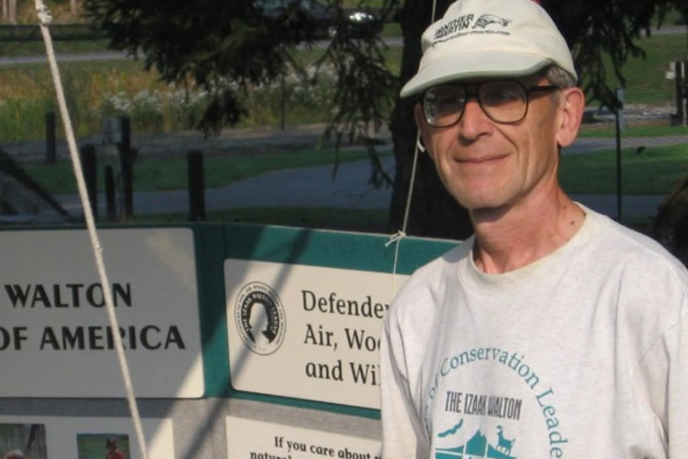 Les Monostory, older white male in biege baseball cap