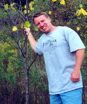 Dylan Parry holding a branch