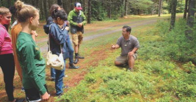 Students looking at a field demonstration