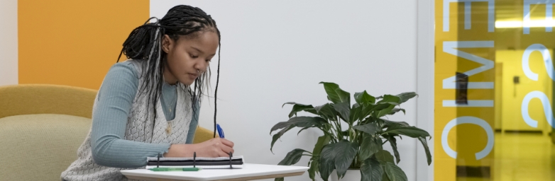 Student seated working at a desk at the Academic Success Center.