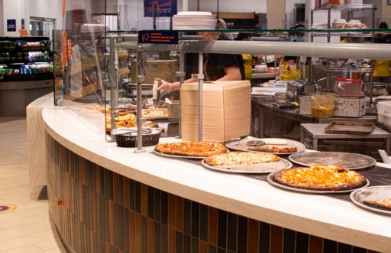 Counter with pizzas at a SU dining center.