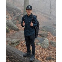 marcelino solano standing on a rock with both thumbs up