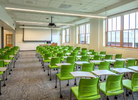 tables and green chairs in one of Marshall Hall classroom