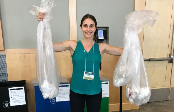 Sue Fassler holding up trash