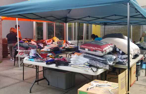 stuff on tables under the tent