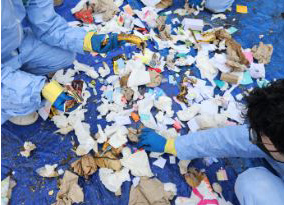 students sorting trash