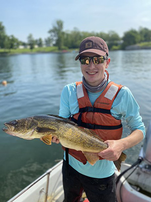 jackson booth on a boat holding a fish