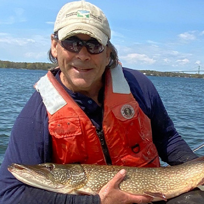 John Farrel holding a pike