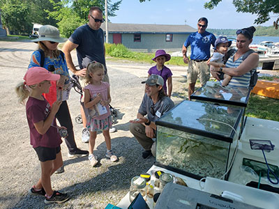 kids and participants learning about the river and the T I B S programs