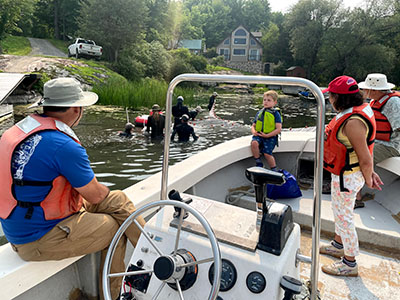 The Magnusons help John check in on the TIBS seining crew 