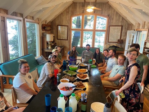 T I B S students and staff at potluck dinner in the main lodge on Governors Island