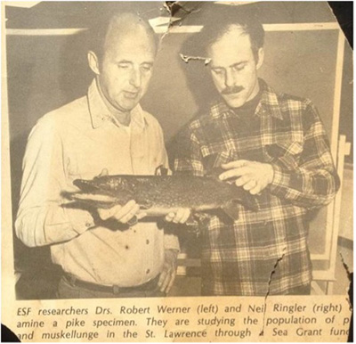 black and white image of robert werner holding a fish