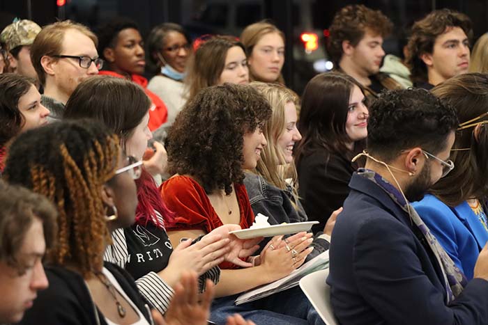 SUNY ESF students and community members smile in the audience at one of the Environmental Storytelling Events about Native Sovereignty led by Ahmad Badr and Ruth Miller. 